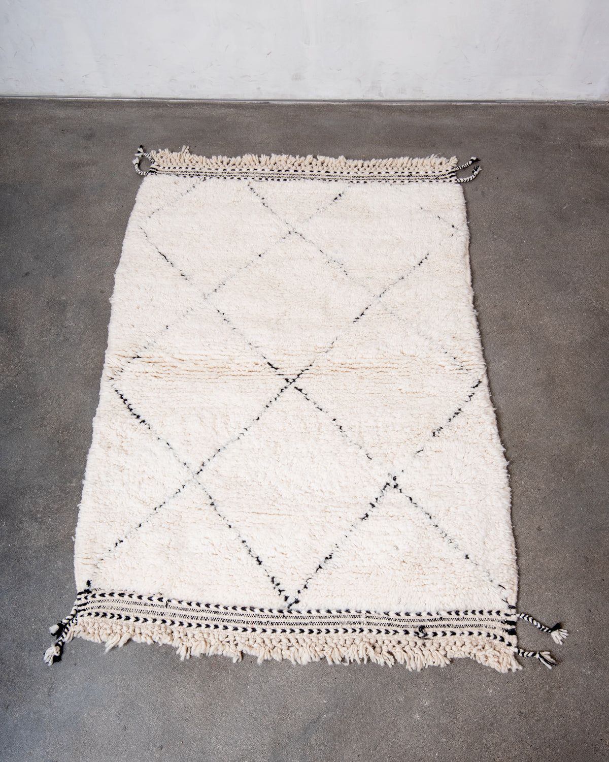 Modern, designer, handcrafted Berber rug from Morocco. Beniourain carpet with minimalist design, natural wool pile and a fluffy texture.